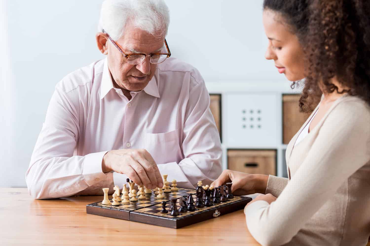 Carer playing chess