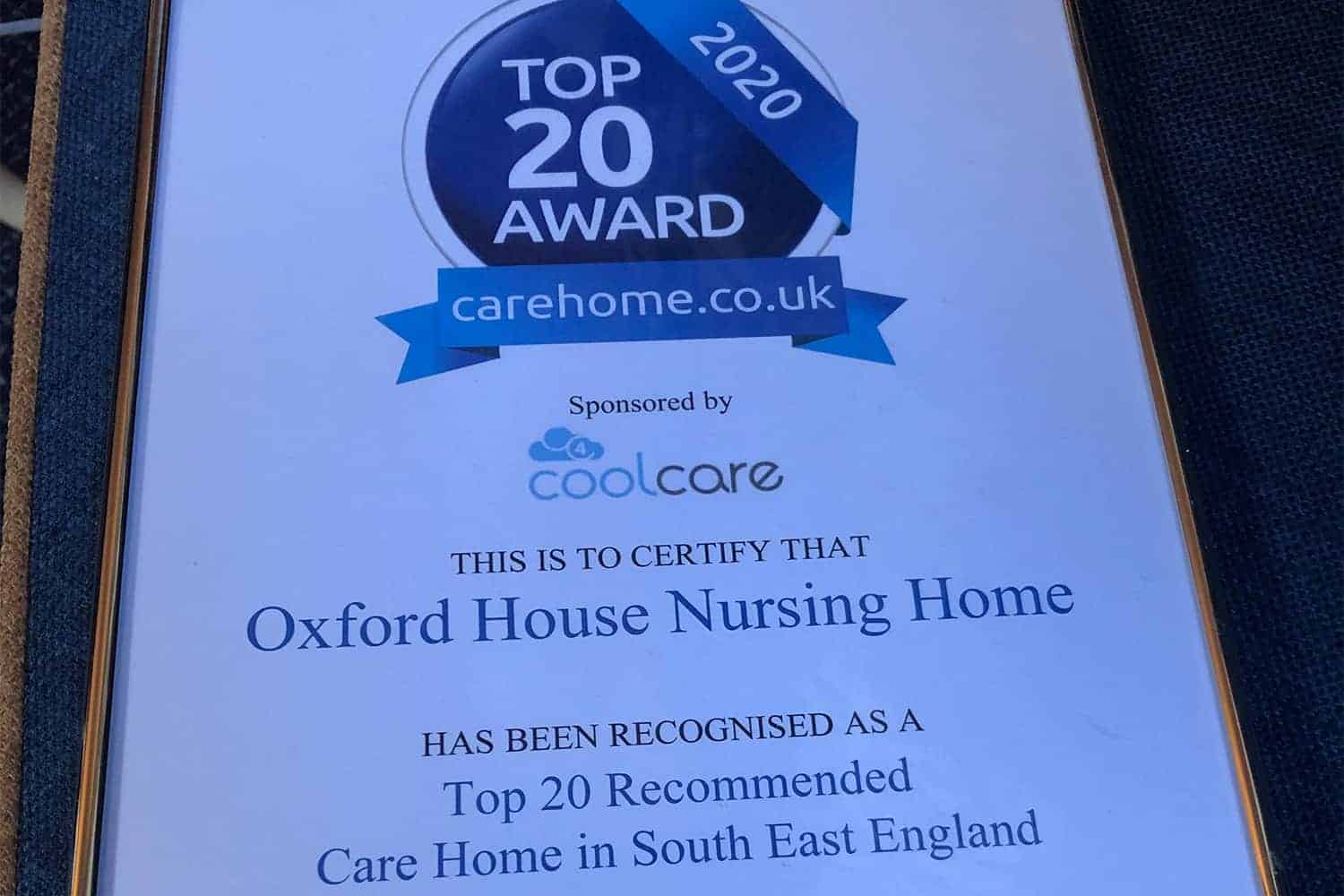 An award certificate for "top 20 care home 2020" from carehome.co.uk, certifying Oxford House Nursing Home as recommended for its elderly care within South East England.